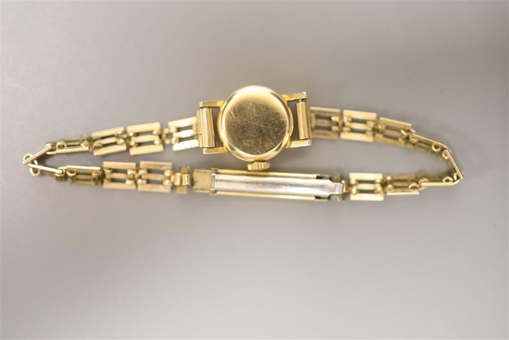 A ladys 1960s 18ct gold Omega manual wind wrist watch, on a gold plated bracelet with box and guarantee,